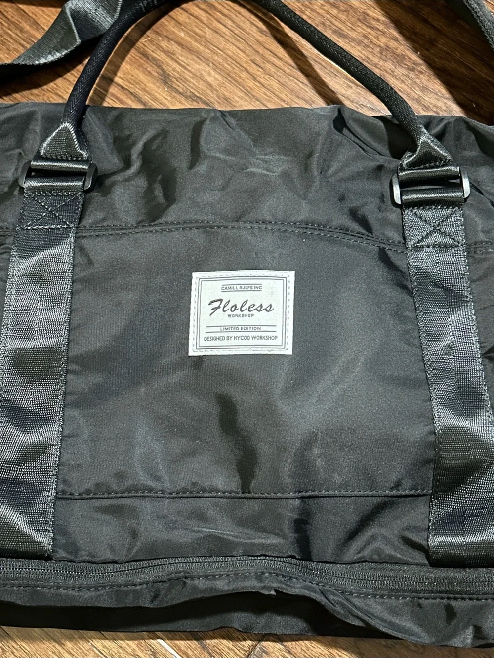 black Floless Workshop limited edition duffel bag with toiletry bag